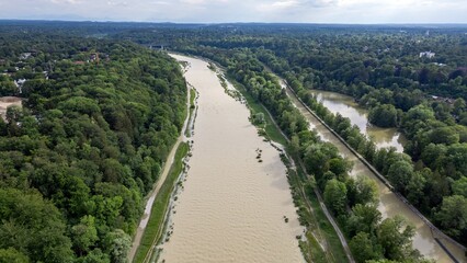 Summer River Isar in Munich Flood View from above. Current and lots of water City and forest Aerial view