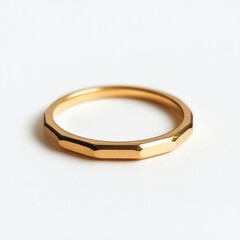 Elegant faceted gold ring on white background