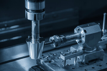 Close up scene the 4-axis EDM machine operation in the light blue scene.