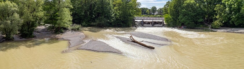 Summer River Isar in Munich Flood Panoramic View from above. Current and lots of water City and...