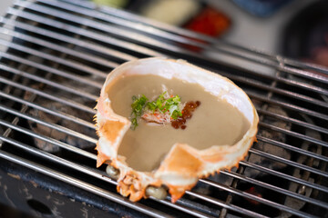 King crab kani miso grilled Japanese meal on stove luxury restaurant