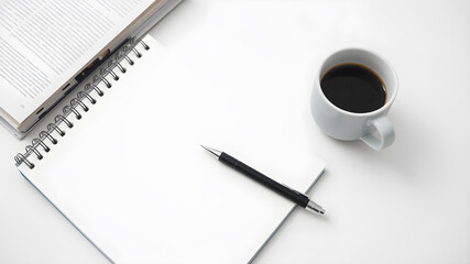 A coffee cup, a pen, and an empty notebook on a minimalist table. Generative AI