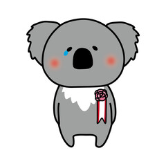 胸にコサージュを付けて泣いているコアラ