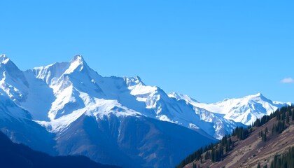 Obraz premium Snow-capped Mountains Under a Clear Blue Sky