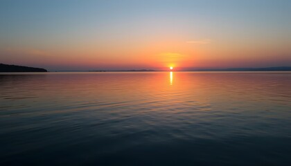Fototapeta premium Serene Sunrise over a Calm Lake