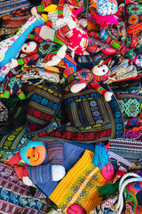 Fototapeta premium Colorful bags and various textiles on the counter at the market in Vietnam in Asia