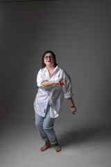 Portrait of a young beautiful plump girl in the studio.