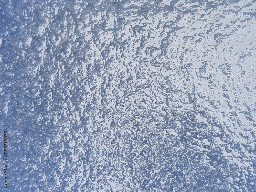 Poster a close-up view of a textured surface with water droplets and a blue hue, creating a fresh and cool 