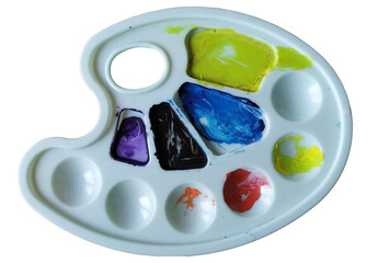 A white palette with a variety of colors on it. The colors are blue, green, red, and yellow....