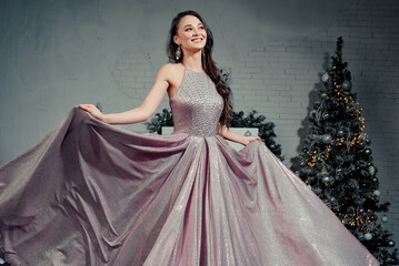 Fototapeta premium Smiling Woman Showcasing Elegant Sparkling Gown.
