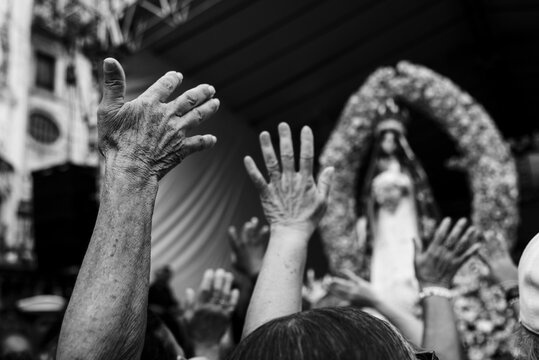 Catholic faithful are seen raising their hands to Our Lady of Conception of the Beach in the city of Salvador, Bahia.