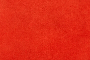 Red suede as a background studio macro photo.