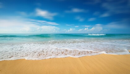Fototapeta premium blurred history of tropical seaside with light surf blue sky and golden sand