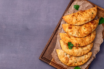 Snack chebureks. Pasties with meat photography . Top view