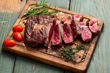 Ribeye grilled  beef steak sliced . Rare doneness photography . Top view