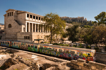 Subway graffiti on Metro Line 1 in Athens, running along the Acropolis and the Temple of...