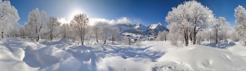 Fototapeta premium Panoramic view of the snowy Alps with deep snow, snow-covered trees, and mountains in the background,