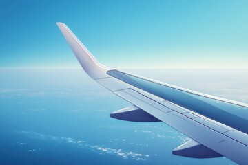Fototapeta premium Wing of airplane flying high above endless blue ocean