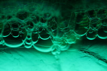 Green bubbles, fantastic liquid connections, fluid movement, dark fantastic background, transparent...