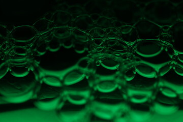 Green bubbles, fantastic liquid connections, fluid movement, dark fantastic background, transparent...