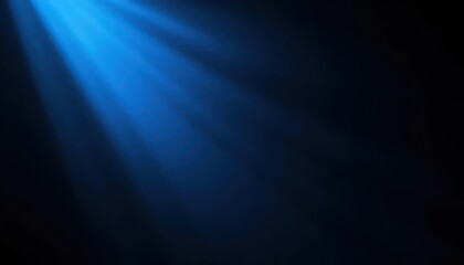 Fototapeta premium Radiant Blue Light Beams Shining on a Dark Background