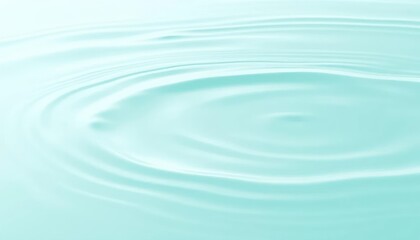 ripples spreading outwards in the tranquil blue water, creating a captivating pattern. The serene and smooth surface reflects light