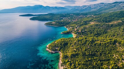 Obraz premium Coastal Paradise: Serene Bay and Lush Mountains