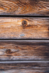 Obraz premium Dark boards with knots as a background for graphics.