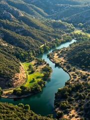 Fototapeta premium Peaceful Aerial View of Winding River Through Green Mountainous Landscape : Generative AI