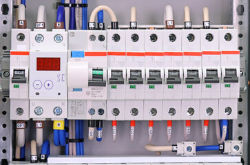 Circuit breakers to protect electrical loads in the electrical switchboard. Soft focus. Close-up. 