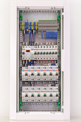 An electric switchboard for the organization of electricity supply to the apartment. Close-up. Soft focus.