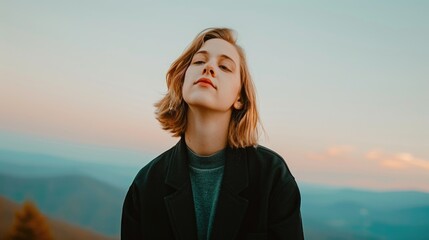 Young caucasian female with short hair posing outdoors at sunset