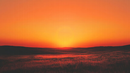 Obraz premium serene sunset over vast grassland with glowing orange sky, creating tranquil and warm atmosphere in natural landscape