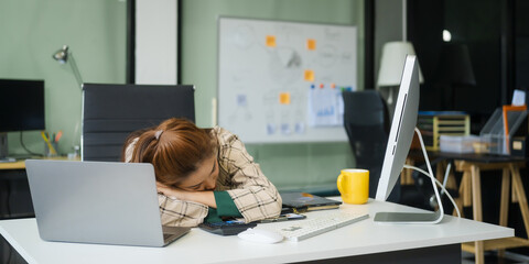 A businesswoman working at a desk in an office struggles with stress and headaches caused by Office Syndrome, a condition linked to prolonged sitting excessive computer use during long working hours