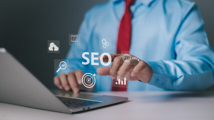 SEO search engine optimization concept. Businessman using a computer for analysis. SEO search engine optimization marketing Ranking traffic website internet business technology concept.
