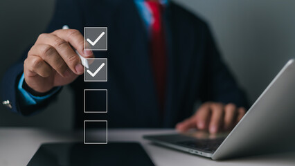 Businessman using stylus pen doing online checklist survey, Business performance checklist,Filling out digital form checklist, Take an assessment, Questionnaire, Evaluation, Survey, Checkmarks