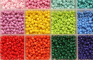 Colorful bead assortment in a grid layout.