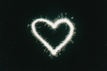 A Valentine heart-shaped sparkler glowing brightly, surrounded by tiny light trails in the dark night sky