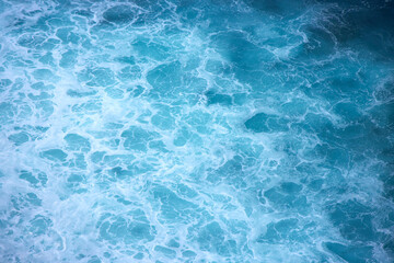Blue and turquoise clean ocean crashing wave. Natural tropical oceanic water beauty.