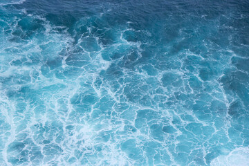Obraz premium Deep blue and clean ocean crashing waves. Natural tropical oceanic water texture.
