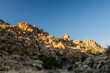 Patching Of Light Brighten Rocky Hill Side In Joshua Tree