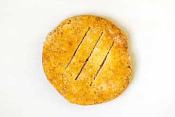 A crispy Bakarkhani, isolated on a white background. This iconic thick flatbread, with its roots in the Mughal period of Bangladesh, is a testament to the region's rich culinary heritage. Top view.