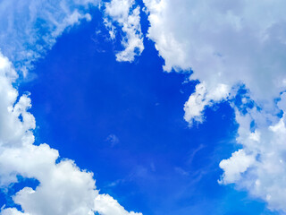 Clouds floating in blue sky.