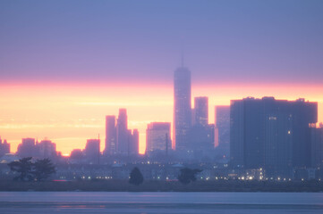 Stunning manhatta NYC skyline during sunrise winter season, far away skyline taken from New Jersy...