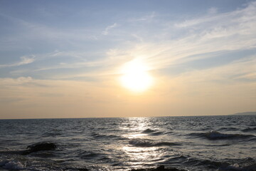 Horizon Sea Sky Background, Sunset sky clouds over the sea in the evening with Orange and yellow sunlight Golden hour in the Summer landscape, Dusk sky seascape backgrounds