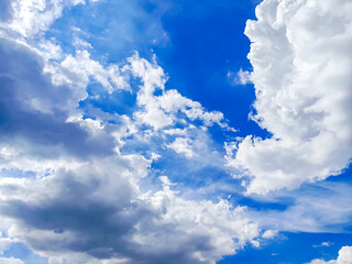 Clouds floating in blue sky.