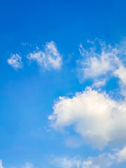 Clouds floating in blue sky.