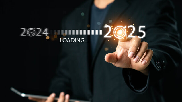Progress and transition from 2024 to 2025 concept. A person pointing to loading bar transitioning from 2024 to 2025, progress, future planning, and new year goals. annual planning and business growth.