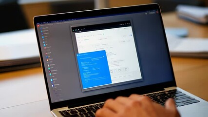 Display of a Laptop Screen with Various Applications - Powered by Adobe