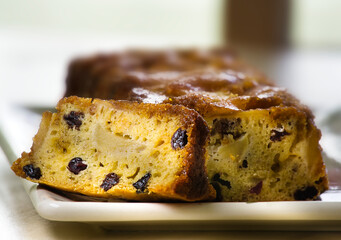 Slice of Sweet Moist English fruitcake with raisins, close-up